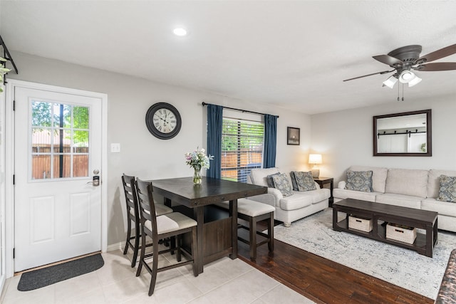living area with plenty of natural light, recessed lighting, ceiling fan, and light tile patterned floors