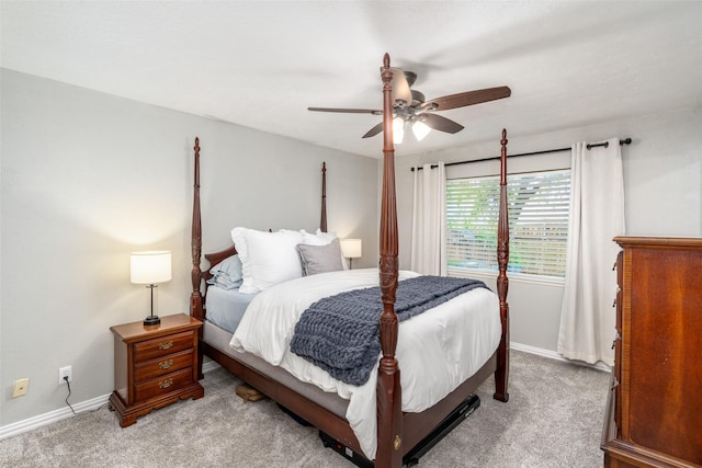 carpeted bedroom with baseboards and ceiling fan