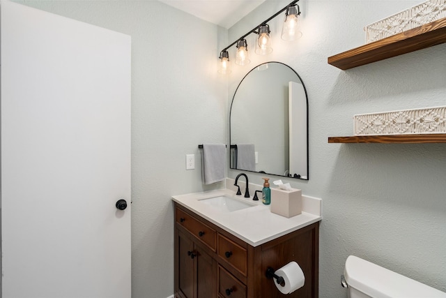 half bath with vanity and toilet