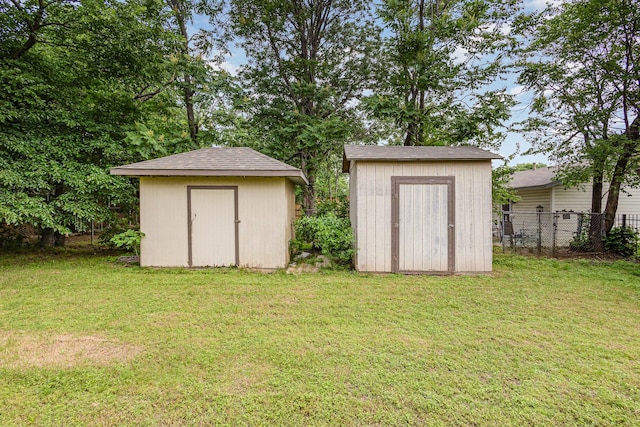 view of shed with fence