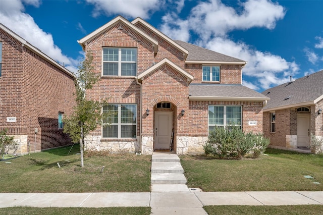 1529 Babb Ln, Celina, TX 75009 - traditional home with brick siding, a front lawn, and roof with shingles