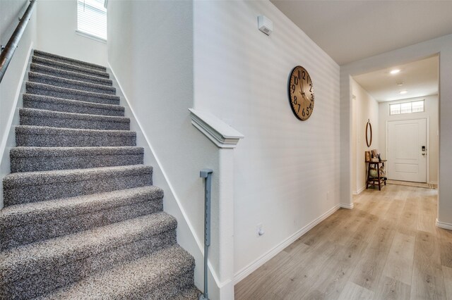 1529 Babb Ln, Celina, TX 75009 - stairway featuring baseboards, wood finished floors, and a wealth of natural light