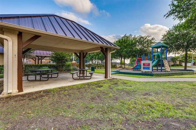 community playground featuring fence, a gazebo, and a yard