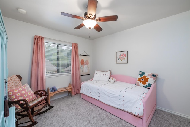 carpeted bedroom featuring a ceiling fan