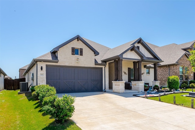 621 Hazeltine Rd, Red Oak, TX 75154 - view of front facade with concrete driveway, brick siding, cooling unit, and a front lawn