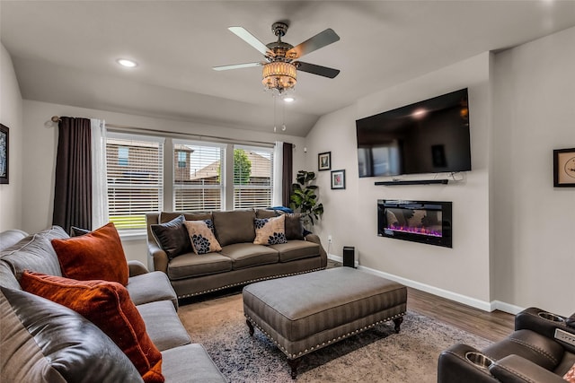 621 Hazeltine Rd, Red Oak, TX 75154 - living area featuring ceiling fan, wood finished floors, baseboards, a glass covered fireplace, and lofted ceiling