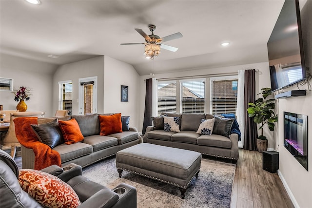 621 Hazeltine Rd, Red Oak, TX 75154 - living room with a ceiling fan, wood finished floors, baseboards, lofted ceiling, and recessed lighting