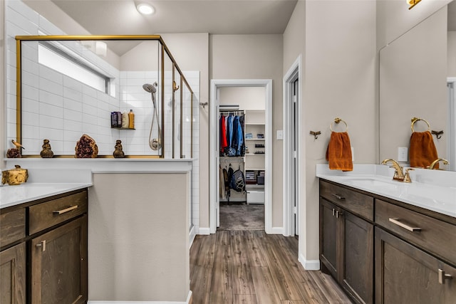 621 Hazeltine Rd, Red Oak, TX 75154 - bathroom featuring vanity, a stall shower, a walk in closet, wood finished floors, and recessed lighting