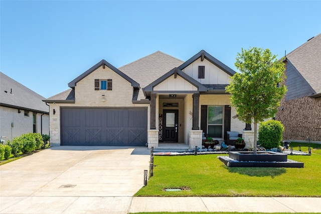 621 Hazeltine Rd, Red Oak, TX 75154 - view of front of house featuring board and batten siding, concrete driveway, a front lawn, a shingled roof, and brick siding