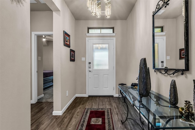 621 Hazeltine Rd, Red Oak, TX 75154 - foyer with baseboards, a notable chandelier, visible vents, and dark wood-type flooring