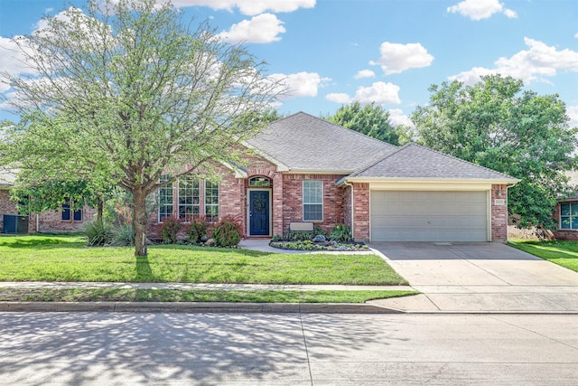 view of front of house featuring a garage, brick siding, a front lawn, driveway, and a shingled roof