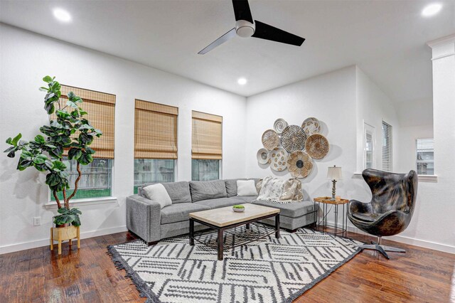 living area with wood finished floors, ceiling fan, and baseboards