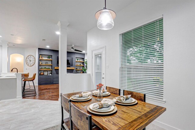 dining room with healthy amount of natural light, lofted ceiling, and baseboards