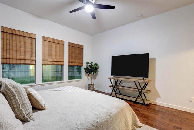 living room featuring ceiling fan, a fireplace, wood finished floors, built in features, and recessed lighting
