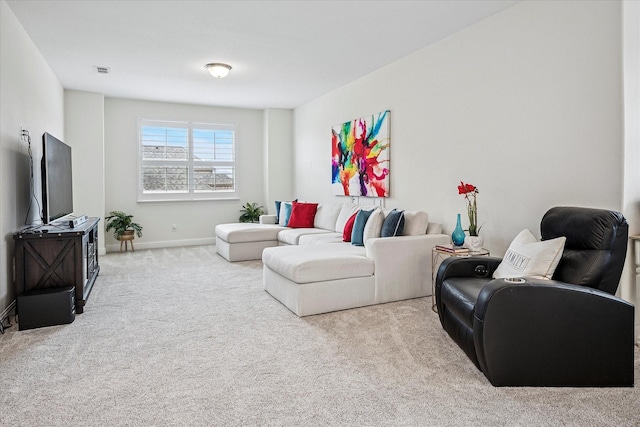 living area featuring carpet floors, baseboards, and visible vents