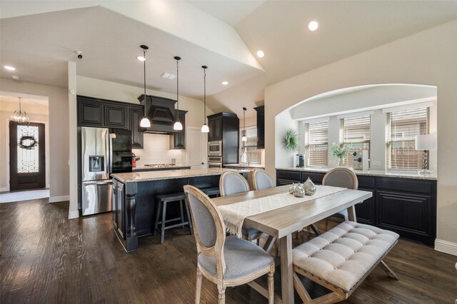 dining space featuring an inviting chandelier, recessed lighting, baseboards, lofted ceiling, and dark wood-style floors