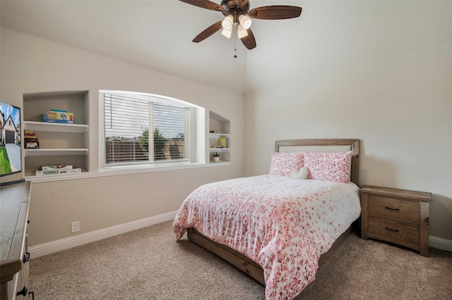 bedroom with carpet floors, baseboards, and lofted ceiling