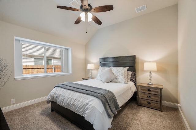 bedroom featuring carpet floors, baseboards, visible vents, and lofted ceiling