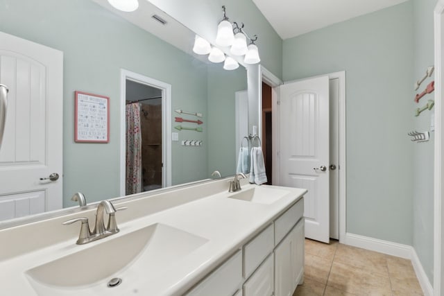 full bathroom featuring a sink, baseboards, tile patterned flooring, and visible vents