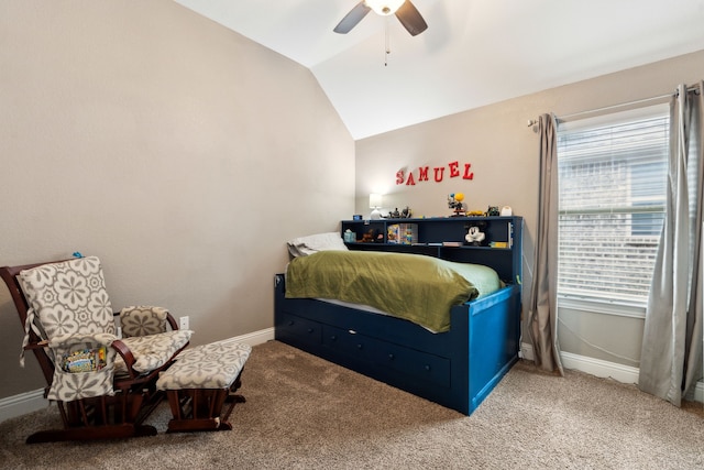carpeted bedroom featuring a ceiling fan, baseboards, and vaulted ceiling