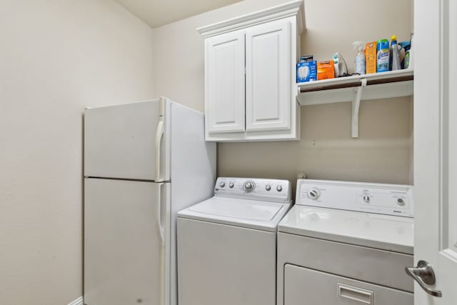 laundry room featuring cabinet space and washing machine and clothes dryer