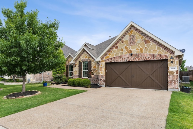 view of front of property with a garage, a front yard, stone siding, and concrete driveway