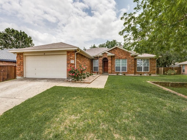 8410 Victory St, Rowlett, TX 75089 - ranch-style house featuring fence, a front lawn, brick siding, a garage, and driveway