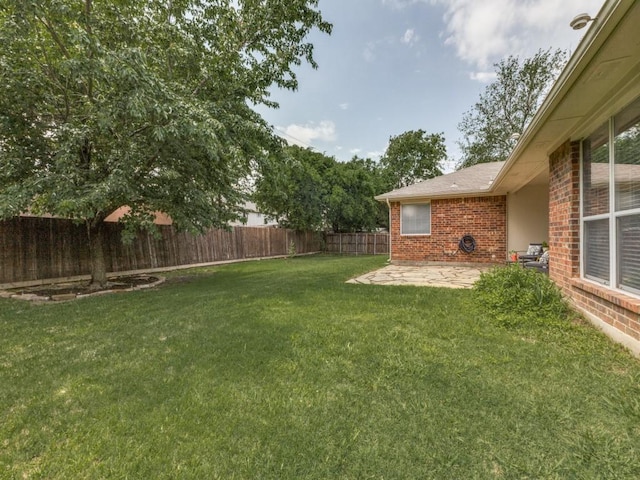 8410 Victory St, Rowlett, TX 75089 - view of yard with a fenced backyard and a patio area