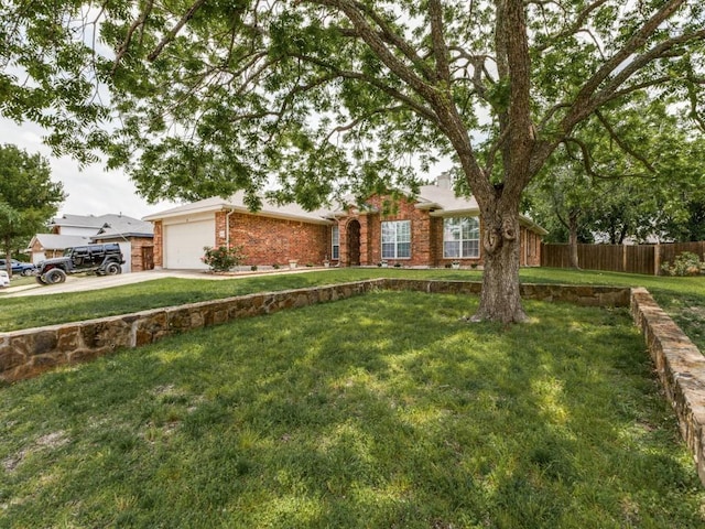 8410 Victory St, Rowlett, TX 75089 - single story home with driveway, a front yard, a garage, brick siding, and fence