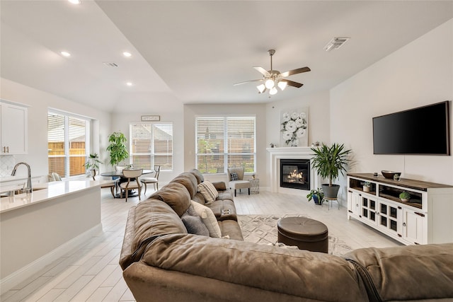 704 Fencerow Trl, Weston, TX 75009 - living area featuring light wood-type flooring, plenty of natural light, ceiling fan, vaulted ceiling, and recessed lighting
