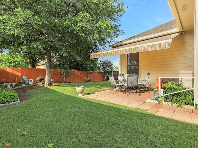 view of yard featuring a patio and a fenced backyard
