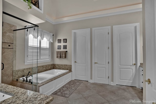1123 Waters Edge Cir, Shreveport, LA 71106 - bathroom with crown molding, tile patterned flooring, a stall shower, and a bath