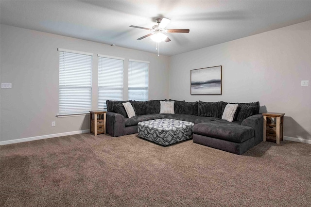 living area with carpet floors, baseboards, and ceiling fan