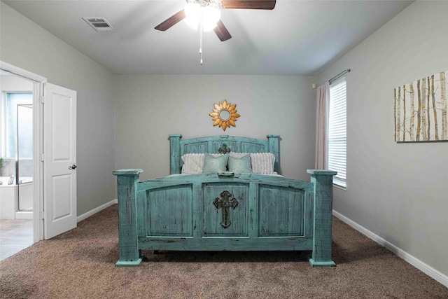bedroom featuring baseboards, visible vents, and dark colored carpet
