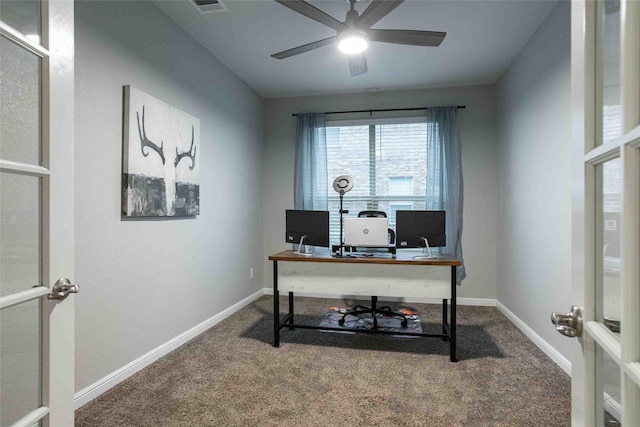office with baseboards, carpet flooring, and a ceiling fan