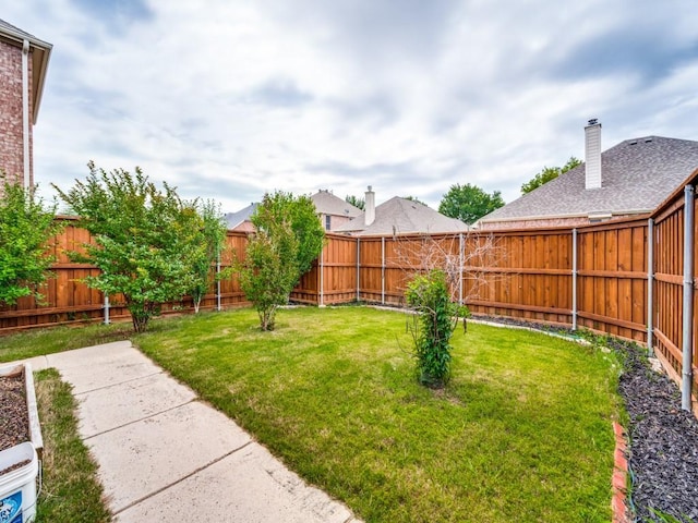 view of yard featuring a fenced backyard