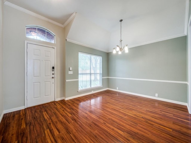 entryway featuring crown molding, dark wood-style flooring, baseboards, and a chandelier