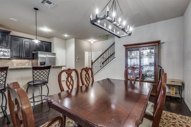 dining area featuring dark wood-style flooring, visible vents, stairway, baseboards, and recessed lighting
