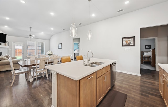 kitchen with a sink, dishwasher, open floor plan, dark wood-type flooring, and visible vents