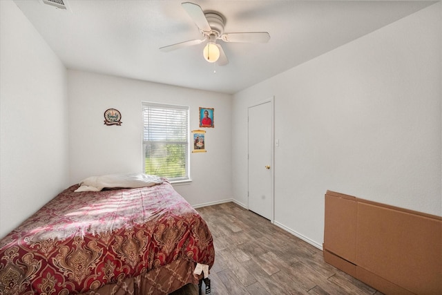 bedroom featuring a ceiling fan and wood finished floors