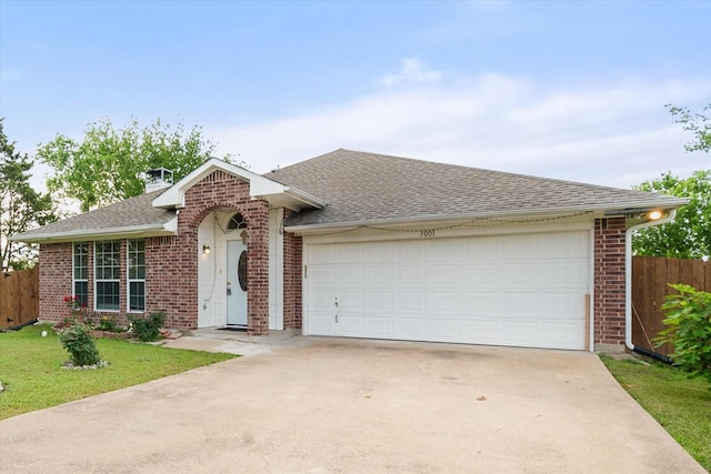 ranch-style home featuring fence, a garage, driveway, and brick siding
