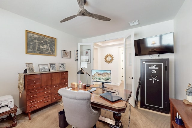 office area with baseboards, ceiling fan, light colored carpet, and visible vents