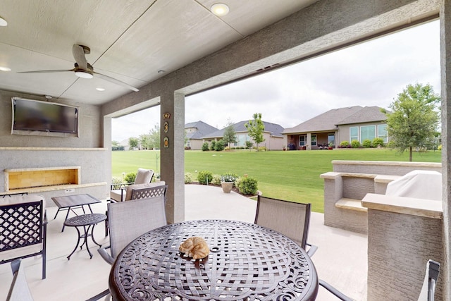 view of patio / terrace with a ceiling fan and outdoor dining area