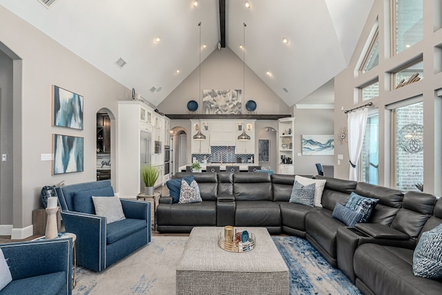 4241 Tranquility Ln, Prosper, TX 75078 - living room with high vaulted ceiling, arched walkways, recessed lighting, beamed ceiling, and baseboards