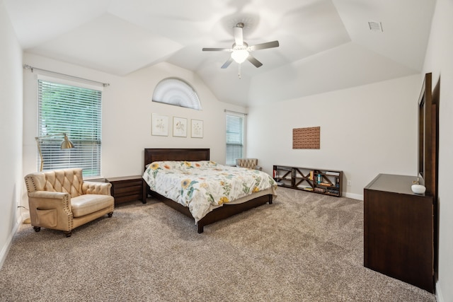 carpeted bedroom with a ceiling fan, baseboards, visible vents, and lofted ceiling