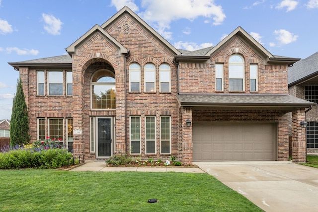 view of front of home with brick siding, a garage, fence, and concrete driveway