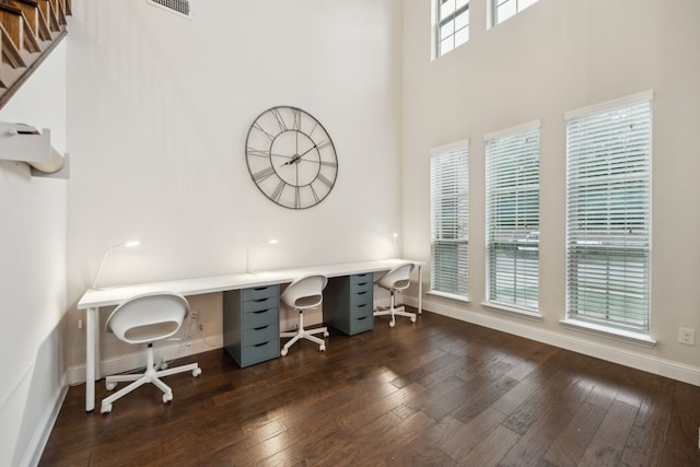 1344 Caspian Dr, Roanoke, TX 76262 - home office with a towering ceiling, baseboards, and hardwood / wood-style floors