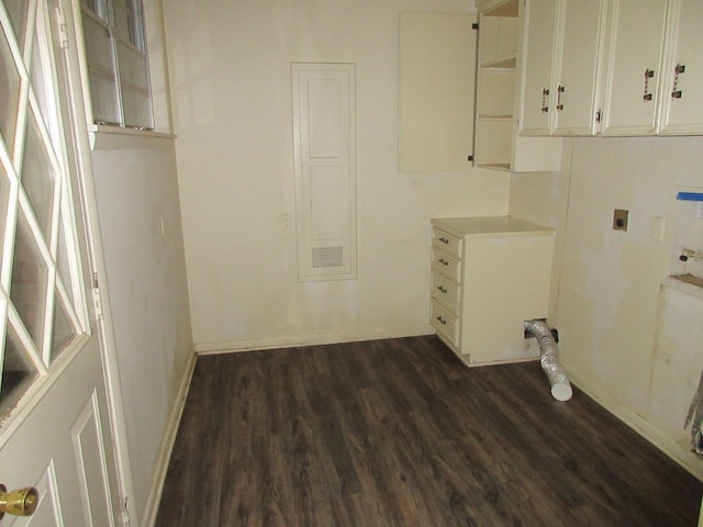 washroom featuring baseboards, hookup for a washing machine, dark wood-style floors, cabinet space, and hookup for an electric dryer