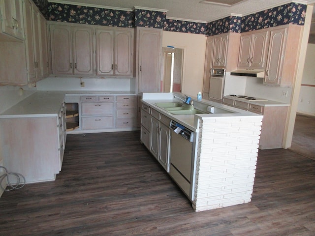 kitchen with dark wood-style flooring, oven, white cooktop, a sink, and dishwasher