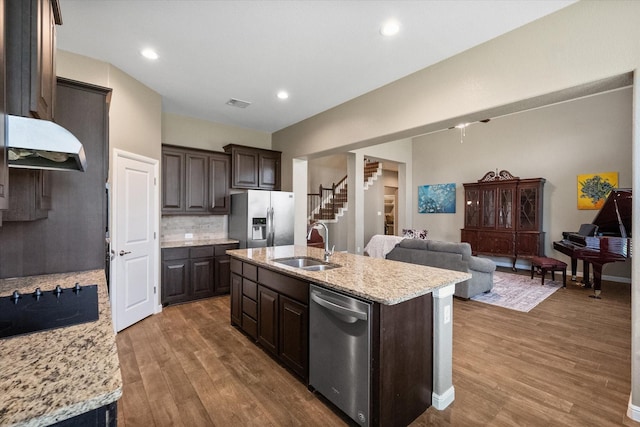 7809 Bella Way, Arlington, TX 76001 - kitchen with stainless steel appliances, a sink, dark brown cabinetry, extractor fan, and wood finished floors